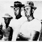 Three men in hats and white t-shirts.