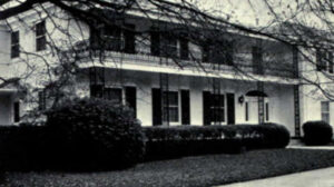 Two story white house, Chi Omega House.