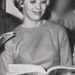 black-white photo of blond wearing glasses