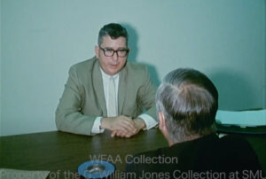 man in gray suit named Leon Horton