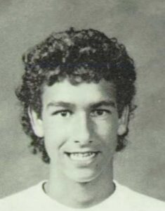 Teenaged boy in white shirt black and white image