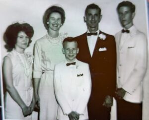 Five people in a wedding photo