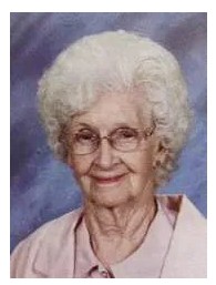 woman with white hair and glasses