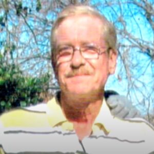 Man with graying hair and glasses