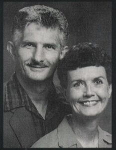 man and woman sitting together
