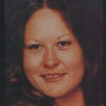 woman with dark hair and eyes headshot