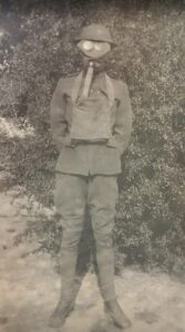 1900s photo of figure in has mask