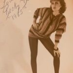 female full body in striped shirt leaning over