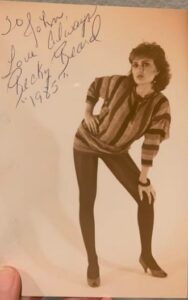 female full body in striped shirt leaning over