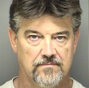 man looking angrily straight ahead