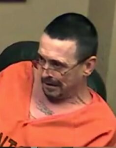 man in orange jail clothing