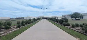 concrete road leading to a prison
