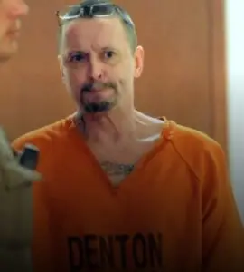 Man in orange prison garb