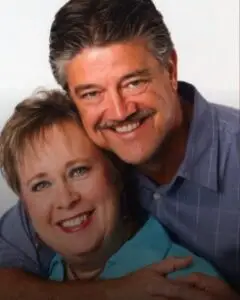 woman and man smiling at camera