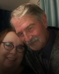 woman and man sitting closely together