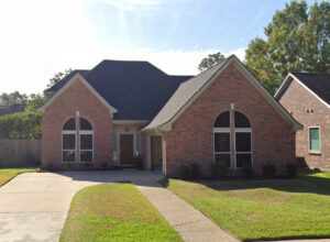 red brick home built in the 1980s